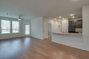 Photo of dining and living area with kitchen at side view